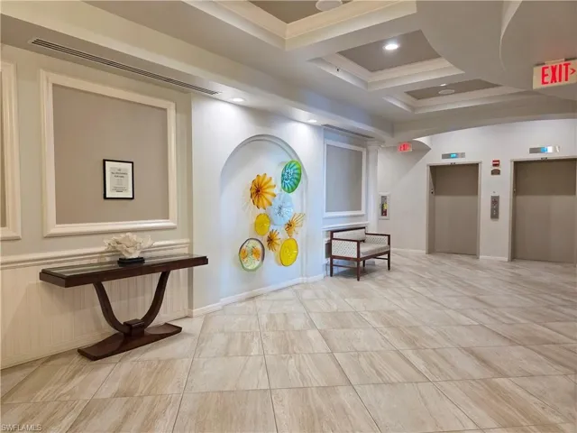 Lobby with coffered ceiling and beam ceiling