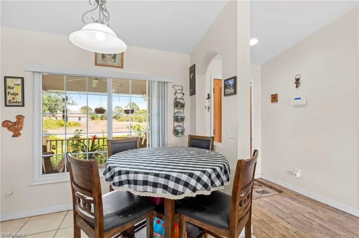 Dining area featuring recessed lighting and arched walkways