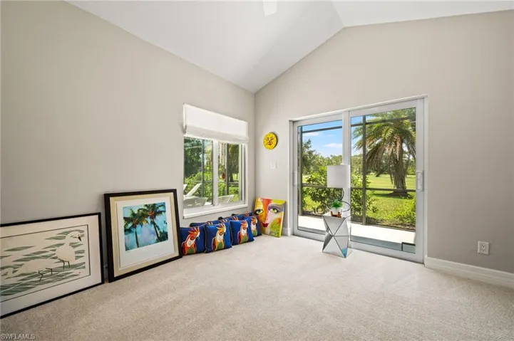 Versatile bonus room offering flexible space for a den or home office, with abundant natural light and direct outdoor access.