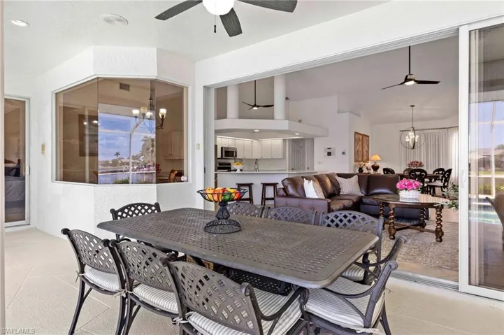 Dining space with a ceiling fan and a chandelier