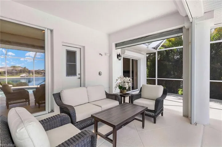 Sunroom / solarium with outdoor lounge area and a water view