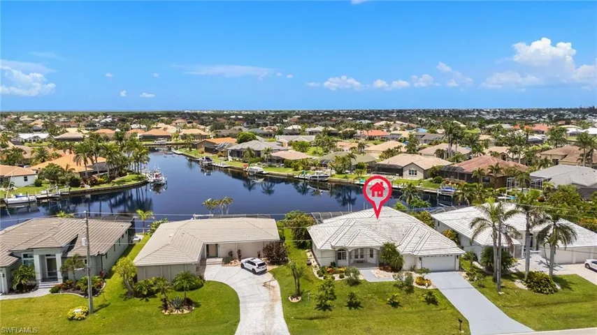 Aerial view of residential area with a nearby body of water