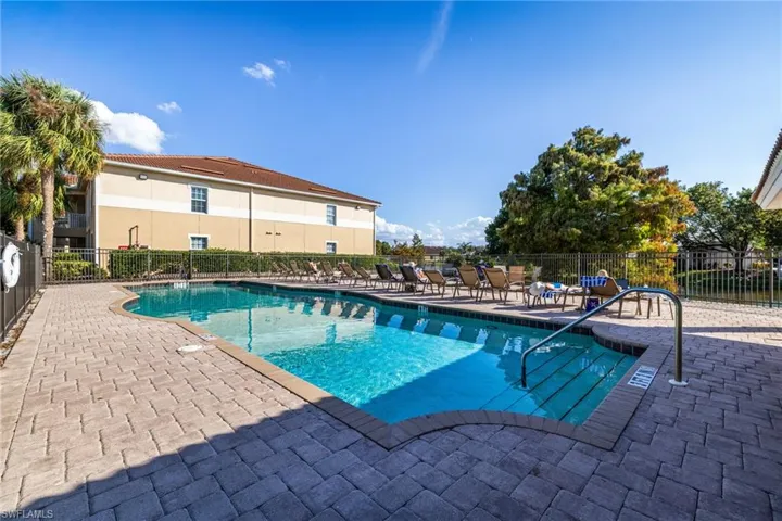 Community pool with a patio area