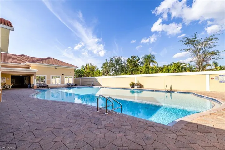Community pool with a patio area