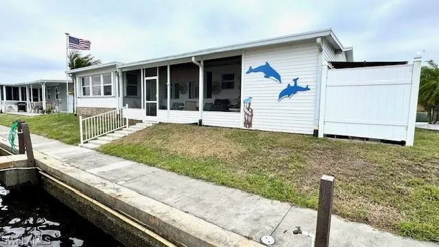 Back of house with a screened in area