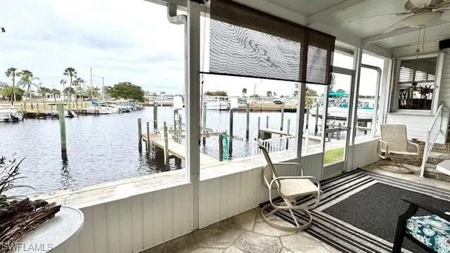 Dock area featuring a water view