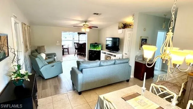 Tiled living room with ceiling fan