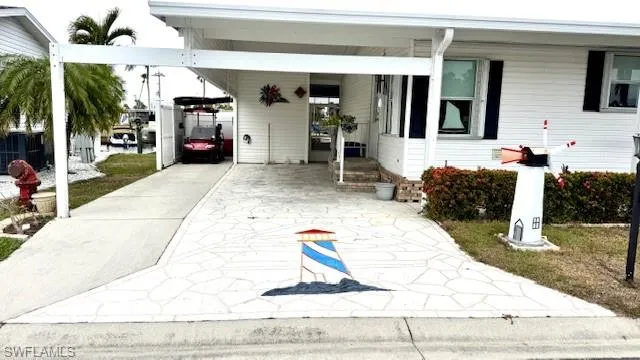 Covered parking with nice decorative drive