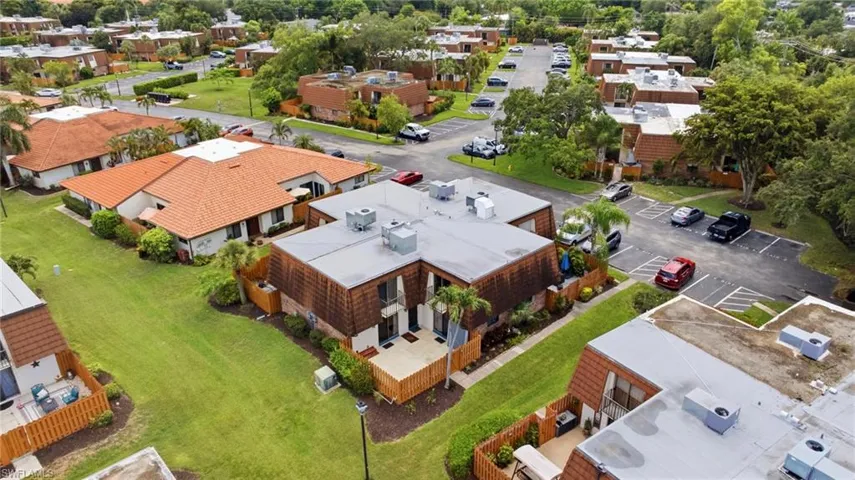 Aerial perspective showcasing a residential community with mature landscaping