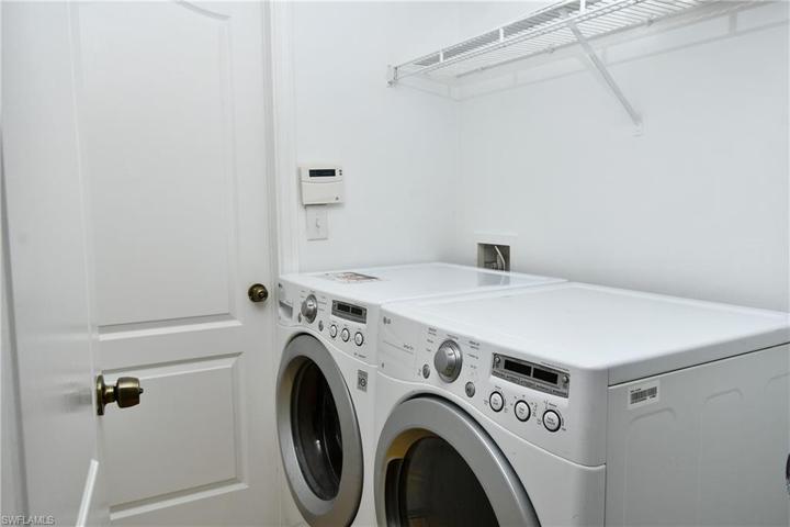 Inside laundry room with 2 storage closets. Off kitchen.