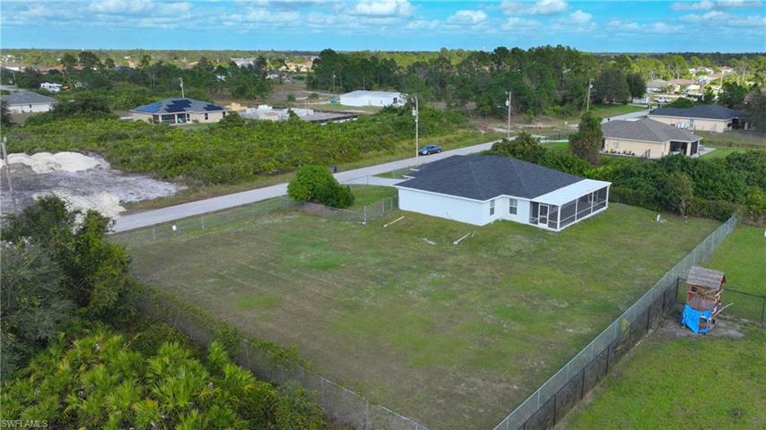 Double lot. Half acre fenced. Room for a pool!