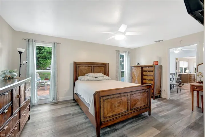 Bedroom with wood-type flooring and ceiling fan