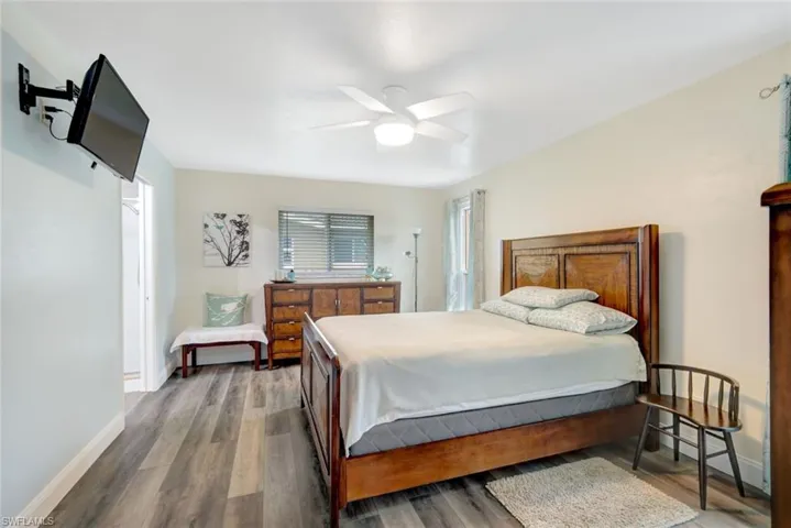 Bedroom featuring hardwood / wood-style floors and ceiling fan