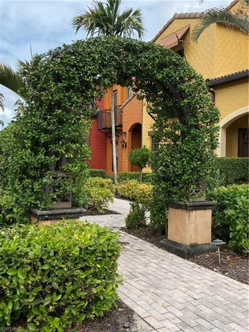 Entrance to property with stucco siding and a tile roof
