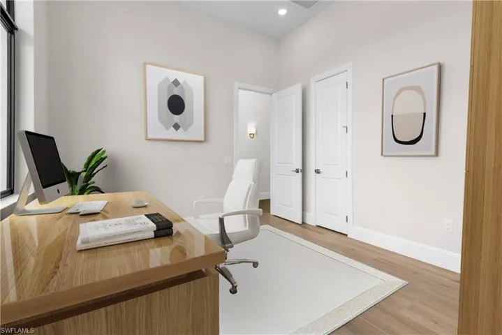 Home office featuring wood finished floors and recessed lighting