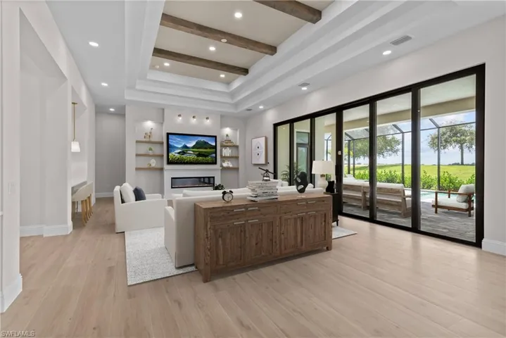 Lobby with beamed ceiling and recessed lighting