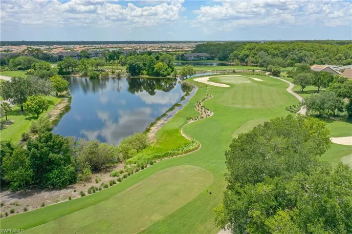 Aerial view of a local golf course and a nearby body of water