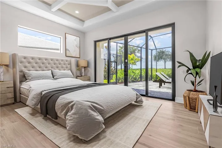 Bedroom with access to outside, beam ceiling, coffered ceiling, recessed lighting, and light wood finished floors