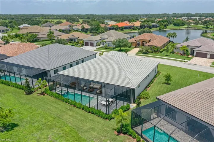 Aerial perspective of suburban area featuring a pool area