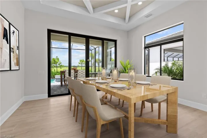 Dining area with recessed lighting, coffered ceiling, light wood finished floors, beam ceiling, and french doors