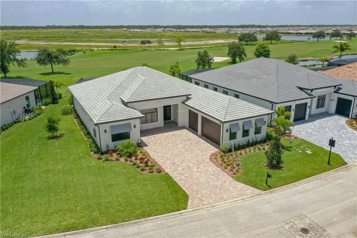 Bird's eye view of a nearby body of water and a golf course