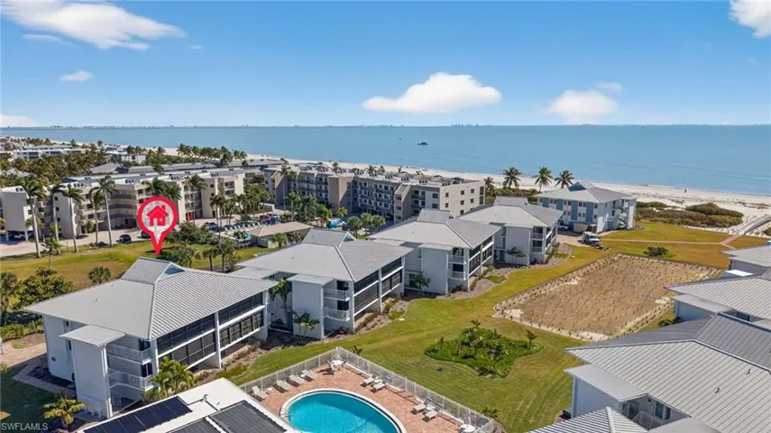 Bird's eye view of a large body of water and apartment complex
