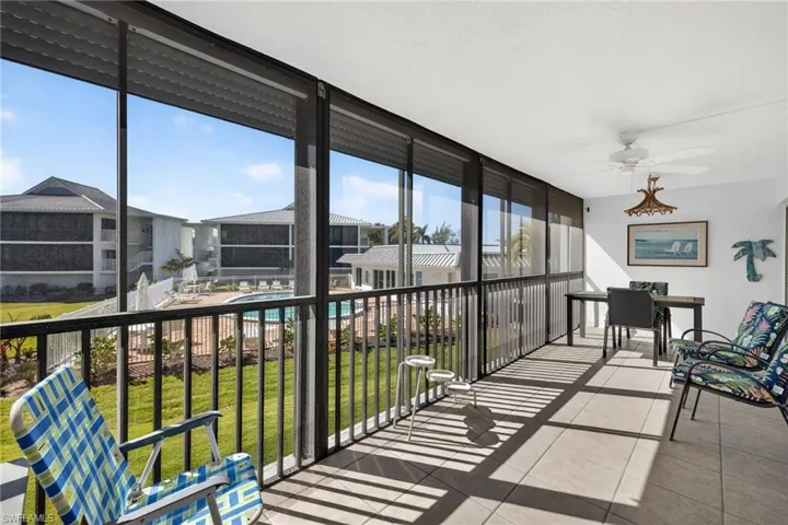 Sunroom / solarium featuring expansive windows and tile patterned floors