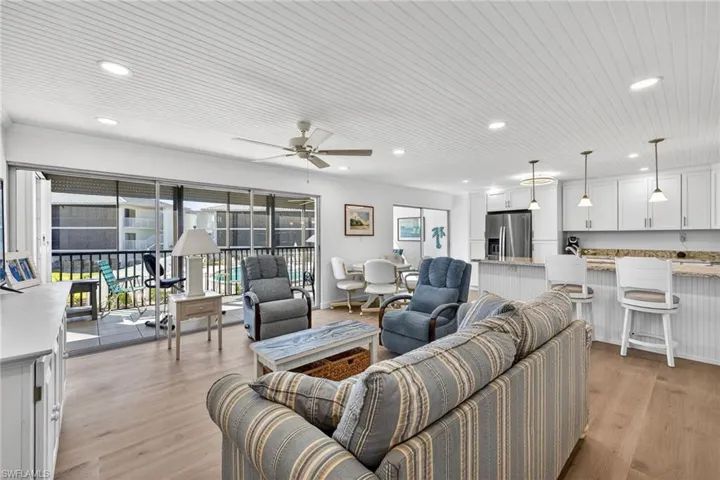 Great room featuring ceiling fan, recessed lighting, light wood-style flooring, and wooden ceiling