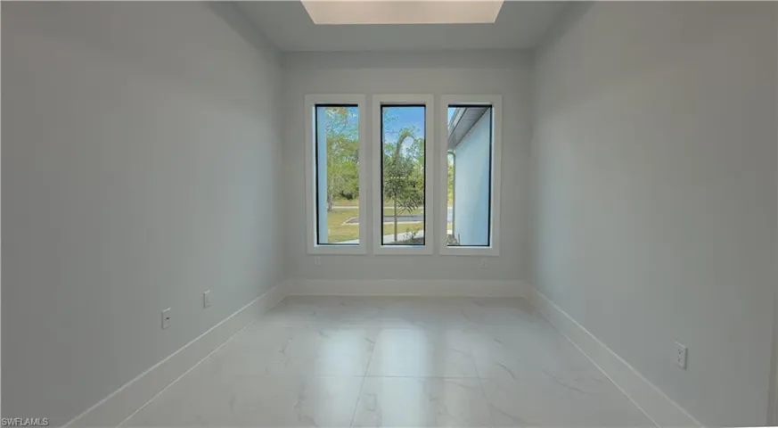 Empty room with light marble finish floors and baseboards