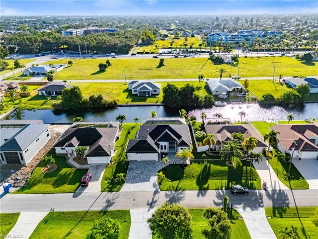 Aerial view of residential area with a nearby body of water