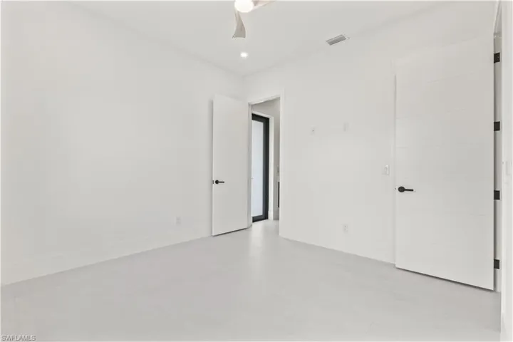 Unfurnished bedroom with ceiling fan and recessed lighting