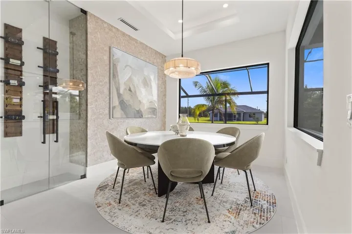Dining area featuring a tray ceiling