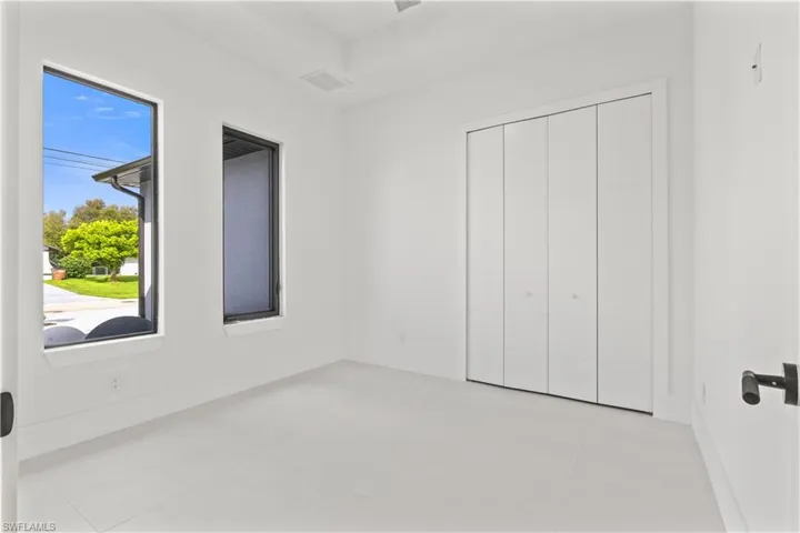 Unfurnished bedroom featuring tile patterned flooring