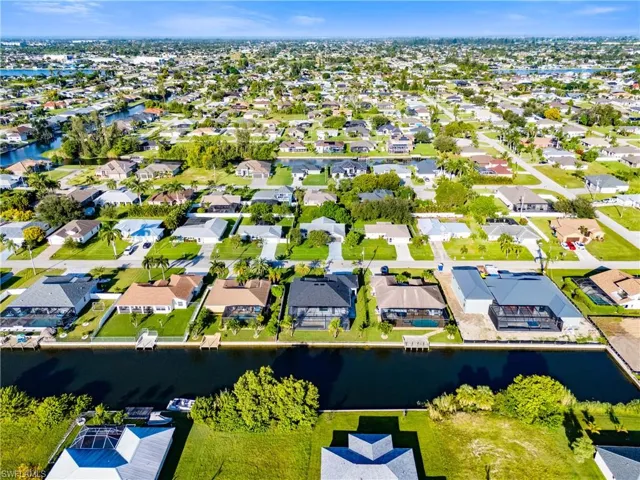 Aerial view of residential area with a large body of water