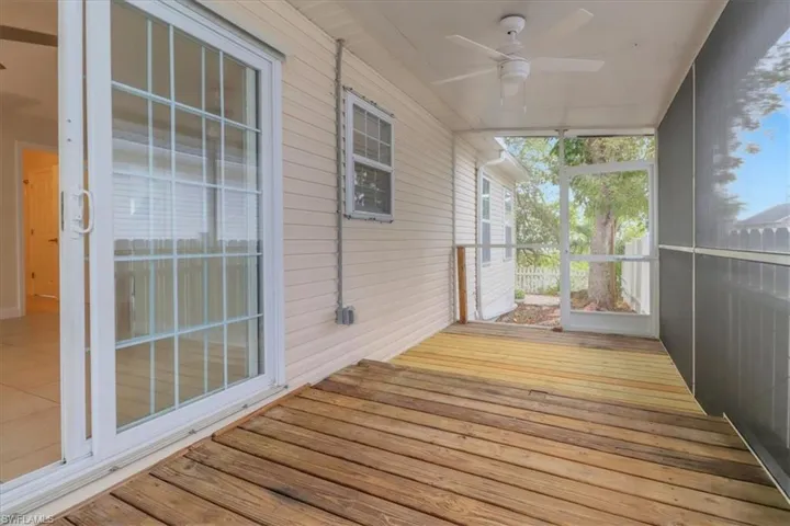 Beautiful screened in lanai/sunroom with ceiling fan