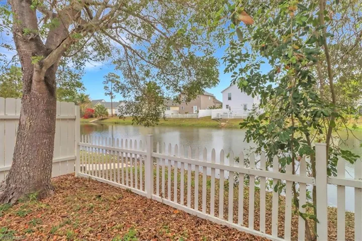 Privacy of mature trees, lake view and fenced in large back yard/patio