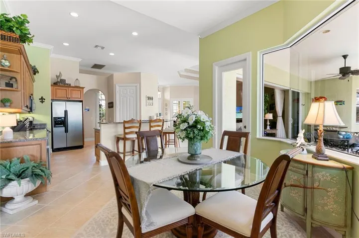 Dining area featuring ceiling fan, crown molding, visible vents, and recessed lighting
