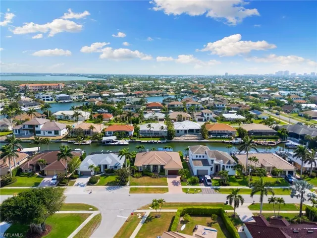 Aerial view featuring a water view and a residential view