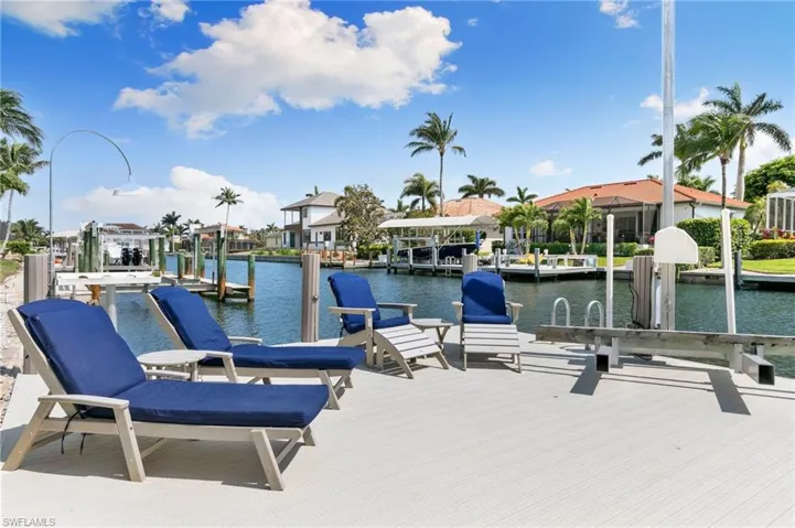 Dock area with a water view and boat lift
