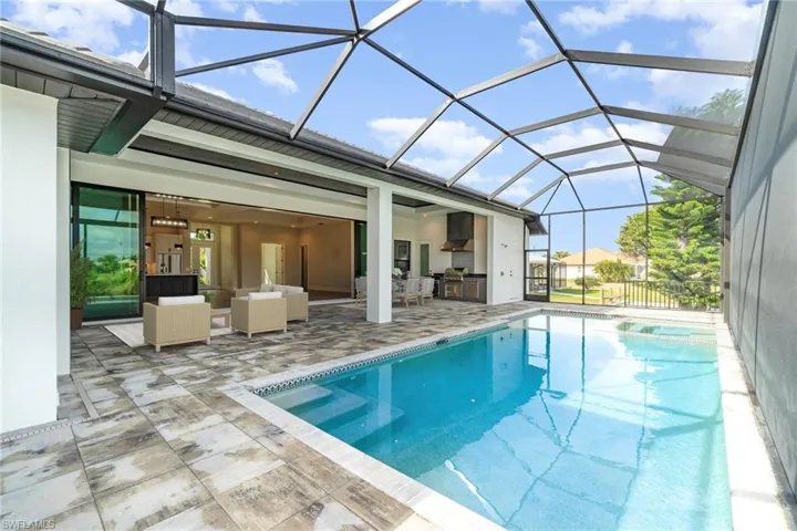 Another pool and view of the massive lanai and summer kitchen
