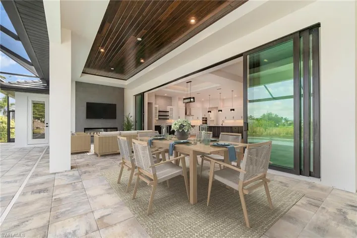 View of huge lanai toward the tv and fireplace area