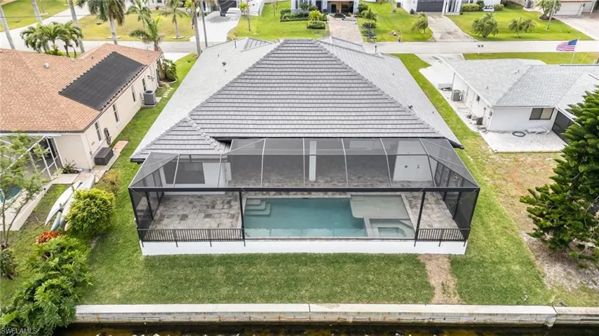 Aerial view showing the pool features and huge lanai