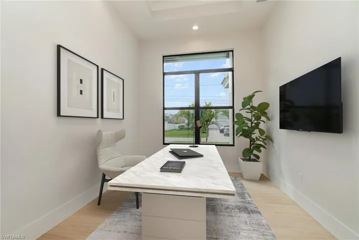 4th Bedroom or office area with light wood plank tile floors and recessed lighting