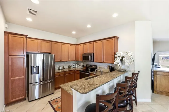Kitchen featuring kitchen bar