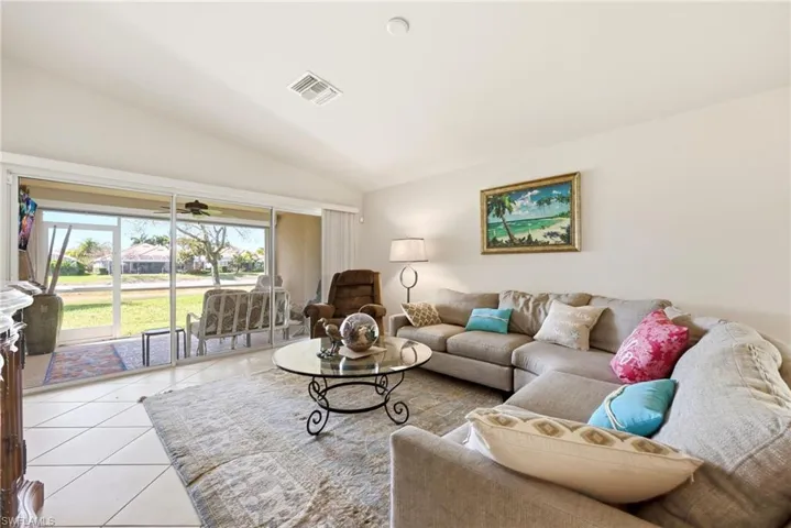 Living area featuring vaulted ceiling