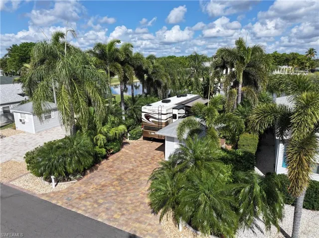 Surrounding community featuring view of scattered trees and a water view