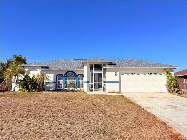 Ranch-style house featuring stucco siding, concrete driveway, a front lawn, an attached garage, and a shingled roof