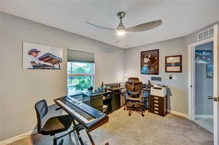 Room featuring light gray wall paint and matching gray carpeting