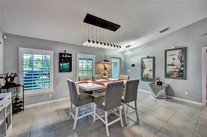 Formal dining area featuring tile flooring and neutral wall tones