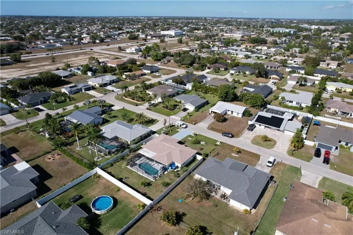 Aerial overview of property's location featuring nearby suburban area